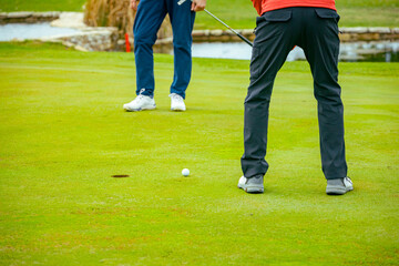 People, golfers enjoying on the golf course