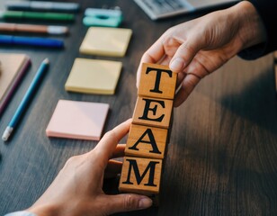  Hands Building the Word TEAM with Wooden Blocks &ndash; Collaboration Concept