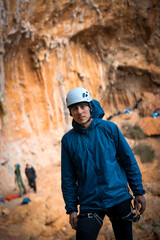 Man is engaged in the rock climbing, hiking outdoors.