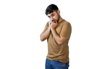 Pensive young man biting his nails on white background. PNG
