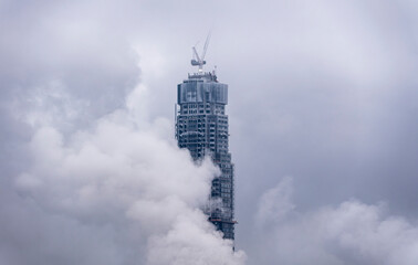 Cloudy Skyline with Tower Under Construction