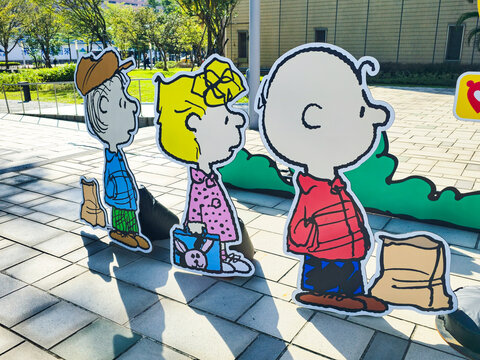 Taipei, Taiwan, Xinyi District, December 15, 2025 &ndash; Snoopy Family Cartoon Character Standees at Christmas with Taipei City Landmarks