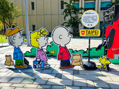 Taipei, Taiwan, Xinyi District, December 15, 2025 &ndash; Snoopy Family Cartoon Character Standees at Christmas with Taipei City Landmarks