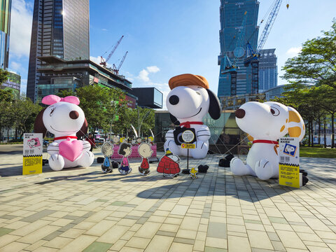 Taipei, Taiwan, Xinyi District, December 15, 2025 &ndash; Inflatable Snoopy Family Characters at Christmas in Taipei with City Landmarks