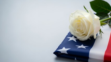 White rose placed on American flag for tribute