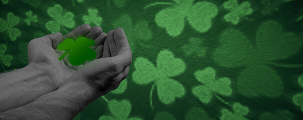 Happy St Patricks Day halftone collage. Hands holding green four leaf clover on green background.