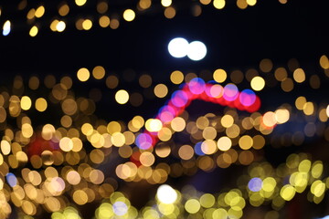 Defocused festive lights in warm night atmosphere