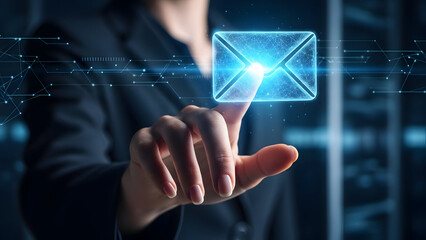 Businessperson interacting with glowing digital envelope in modern workspace