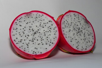 Fresh Dragon Fruit (Pitaya) on White Background, Exotic Tropical Fruit with Vibrant Pink Skin and Juicy Pulp, Healthy Food Concept