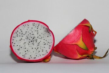 Fresh Dragon Fruit (Pitaya) on White Background, Exotic Tropical Fruit with Vibrant Pink Skin and Juicy Pulp, Healthy Food Concept