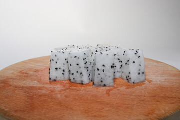 Fresh Dragon Fruit (Pitaya) on White Background, Exotic Tropical Fruit with Vibrant Pink Skin and Juicy Pulp, Healthy Food Concept