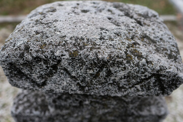 Shallow depth of field (selective focus) details with inscriptions and texture of an old orthodox christian stone cross