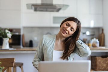 Woman, neck pain and stress with injury for overworked pressure, fatigue or strain in home. Female person, freelancer or remote work with sore shoulder or muscle tension for project deadline in house.