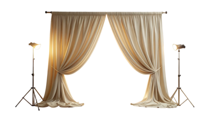 Elegant cream-colored stage curtains flanked by studio spotlights