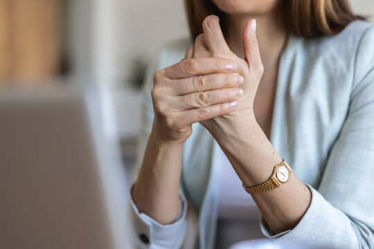 Business woman, hands and wrist pain with injury for carpal tunnel syndrome or strain in home. Female person, freelancer or remote work with sore joint, inflammation or sprain for overworked muscle.