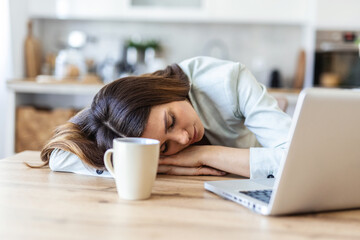 Tired, sleeping and woman on laptop for remote work exhausted for project, report and working from home. Stress, overworked and female person with burnout for nap, relaxing and resting from fatigue.