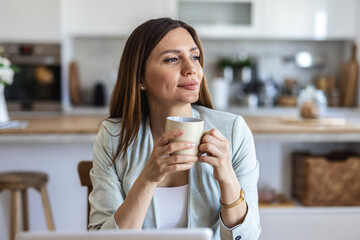 Working from home, freelancer and thinking entrepreneur drinking coffee, taking break and doing remote work while daydreaming idea. Smiling and thoughtful woman planning strategy, vision and mindset