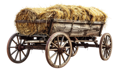 Weathered wooden wagon loaded with a large, golden hay bale