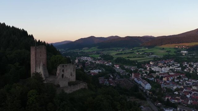 Aerial Video at Dusk of Kastelburg Castle Ruins Above Waldkirch in the German Black Forest.