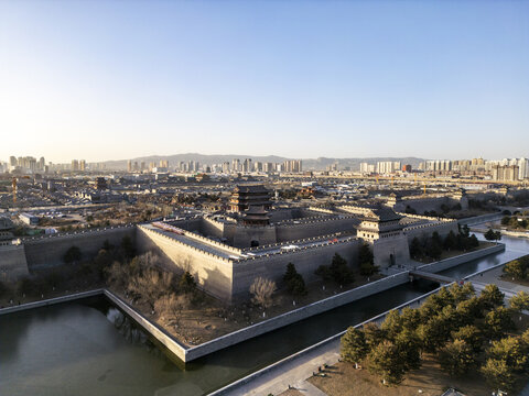 Aerial view of the ancient city walls and moat, where history whispers amidst the modern skyline, creating a striking juxtaposition of old and new, Datong, Shanxi, China.