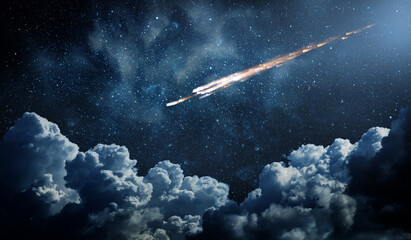 Comet, asteroid, meteorite flying on the background of the starry night sky. Glowing asteroid and tail of a falling comet. Elements of this image furnished by NASA. © Tryfonov