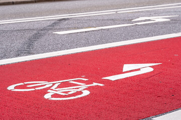 Bicycle arrow painted on cycling lane highlighting urban road infrastructure designed for safe mobility and efficient transportation
