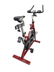 red exercise bike simulator isolated on white background