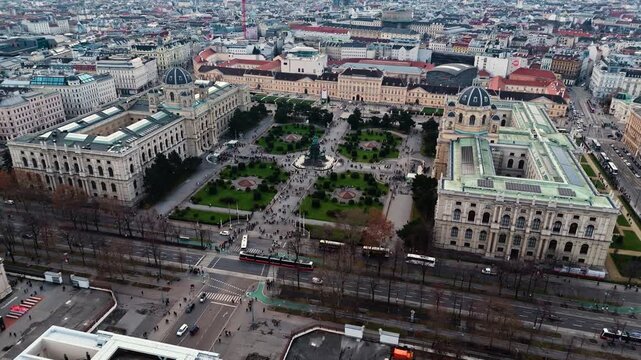 Aerial drone shot panning left over Austria&rsquo;s twin museums in Vienna, revealing the Kunsthistorisches and Natural History Museums framed by surrounding historic buildings and the wider cityscape.
