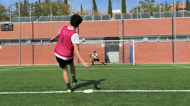 Soccer player scoring a penalty kick goal