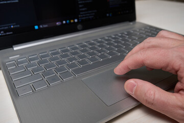 typing on laptop keyboard