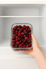 Placing berries in fridge