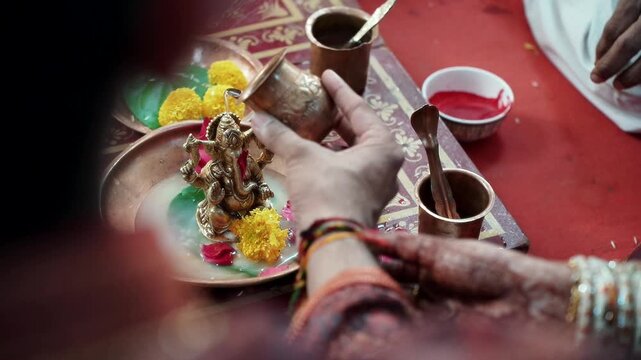 Colorful Indian Celebration With Hands Preparing Plate Of Festive Food And Flowers