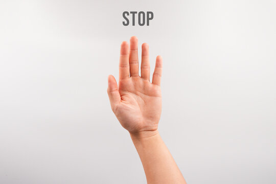 Hand showing stop, fingers outstretched, clear warning or refusal concept on a white background