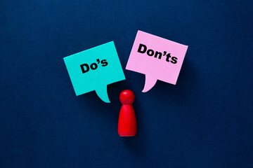 Person choosing between do's and don'ts guidelines