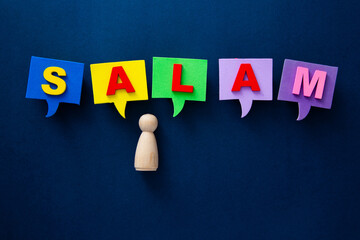 Wooden figure communicating salam in colorful speech bubbles