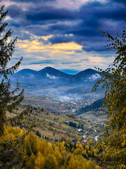Sunny Autumn Carpathians with Puffy White During The Sunset