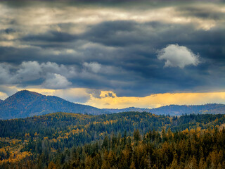 Sunny Autumn Carpathians with Puffy White During The Sunset