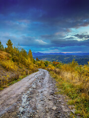 Sunny Autumn Carpathians with Puffy White During The Sunset