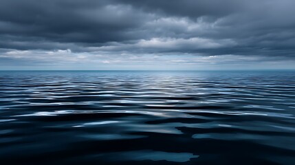 Obraz premium Calm ocean waves under dark clouds serene water surface nature scene tranquil mood