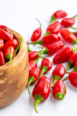 Vibrant red jalapeno pepper on a white background with space for text, ideal for food and culinary concepts.Group of ripe red jalapeno peppers .