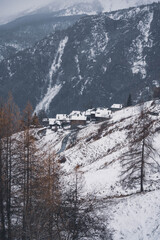 village huts in winter in snowfall