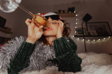 Bored woman with a glass of champagne Tired of Christmas and New Year's holidays