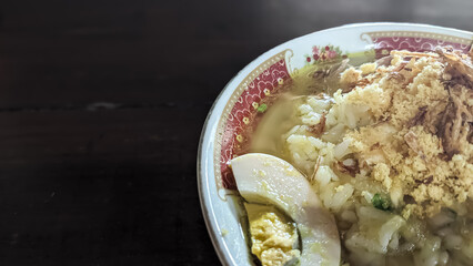 Delicious bowl of Indonesian Soto with crispy fried shallots on top