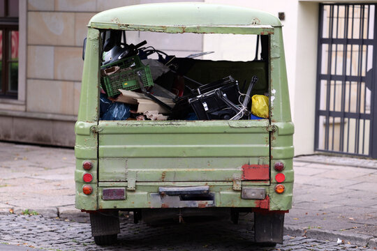 Old Green Utility Vehicle Loaded with Items