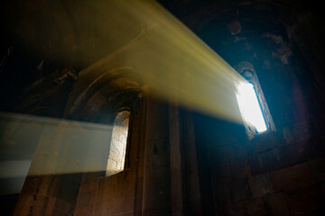 Monastery interior. An old lamp in the church. Sunlight streaming through the windows. Christianity and religion.