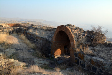 Fortress on a hilltop. Ruined castle. Old architecture.