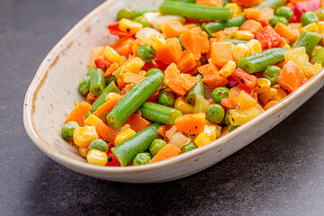 Mexican Mix of Vegetables. Tomatoes, Green Beans, Peas, Corn. Dietary Food.Bright vegetable mix .Vegetarian food.Assorted.