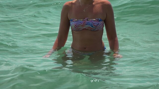 Woman bikini ocean, beautiful relaxing summer vacation in turquoise water