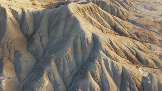 Aerial view of the rugged Calanchi del Cannizzola landscape, showcasing the stark beauty of the badlands with its unique geological formations, Centuripe, Sicilia, Italy.