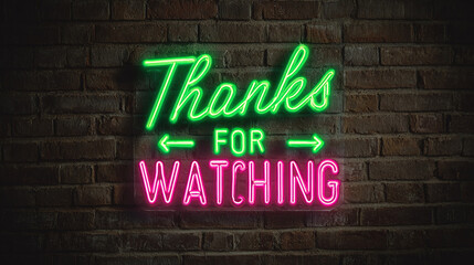 Fototapeta premium Neon sign on brick wall says 'Thanks for Watching'. A vibrant glow emanates from the sign, set against the textured backdrop of the brickwork.